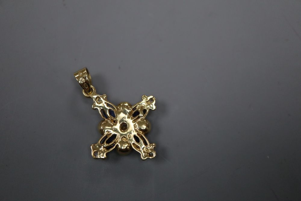 A modern 750 yellow metal, white and blue sapphire and cultured pearl set star pendant, 23mm, gross 4.3 grams.